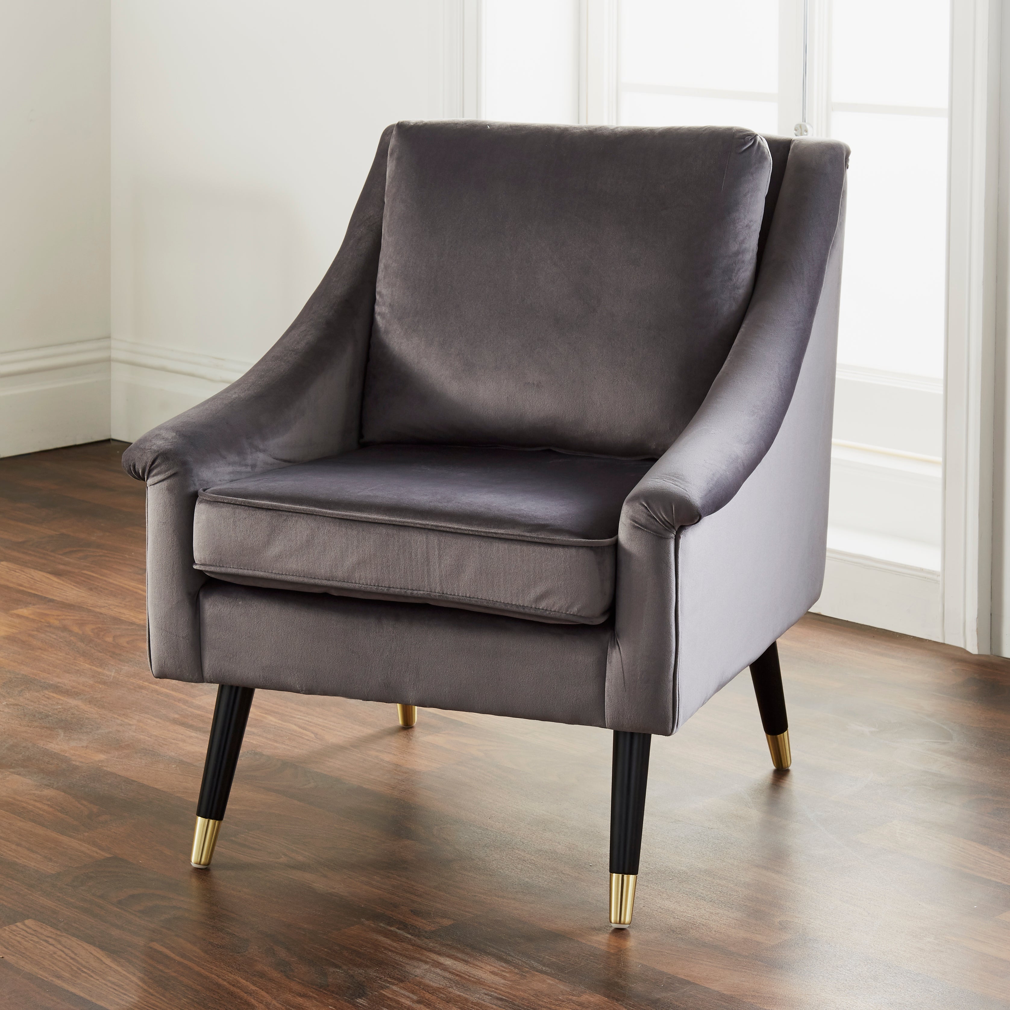 Luxury gray velvet Grace armchair by Harlequin Metis, featuring plush upholstery and elegant design for stylish living spaces.