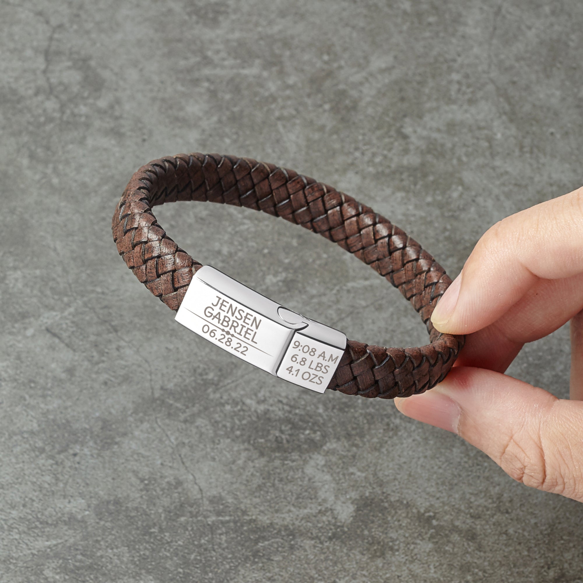 Green Millie baby footprint bracelet for new dads, featuring a personalized design to celebrate first-time fatherhood.