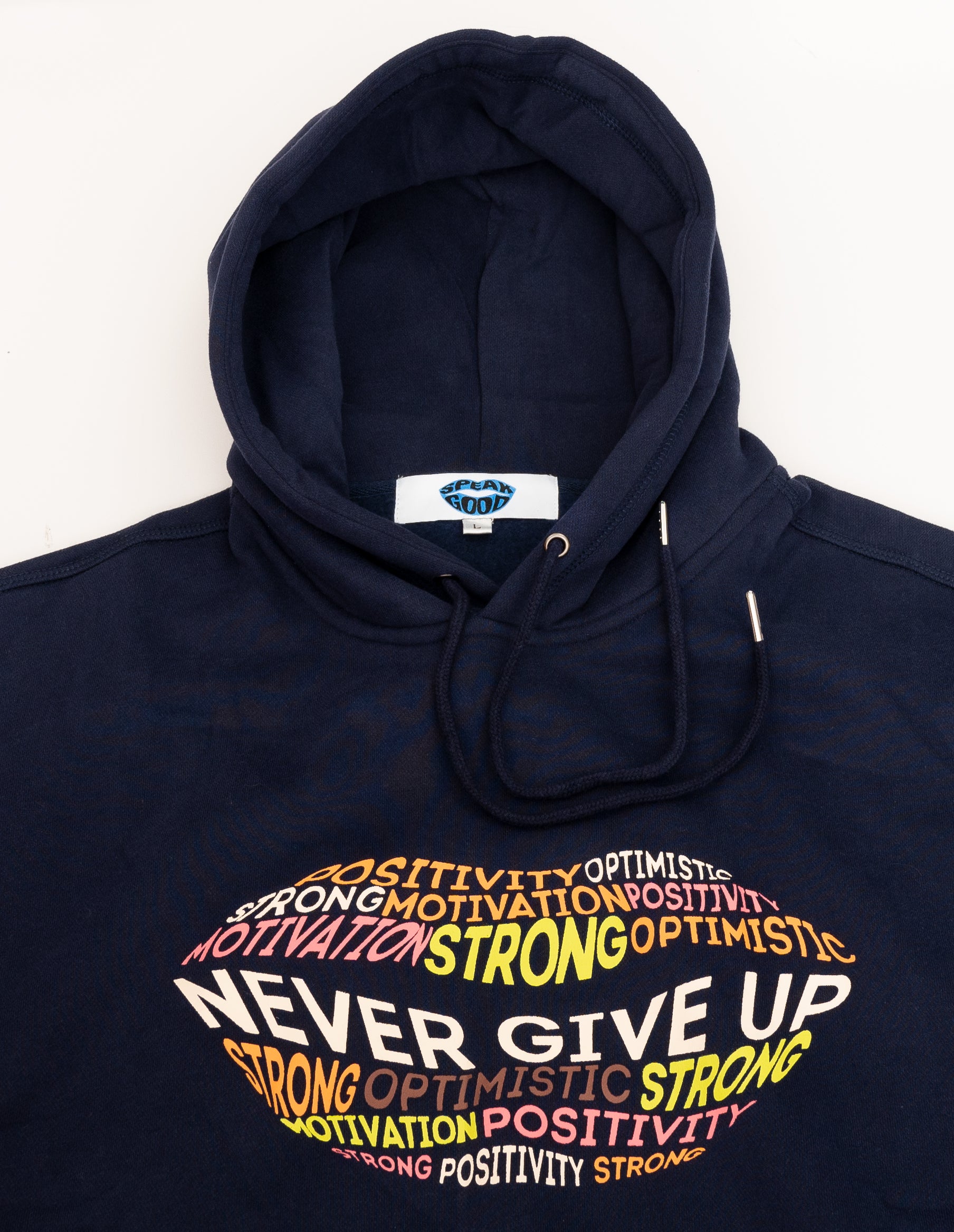 Orange Ash motivational hoodie featuring "Never Give Up" slogan, casual sweatshirt with inspiring design, perfect for everyday wear.