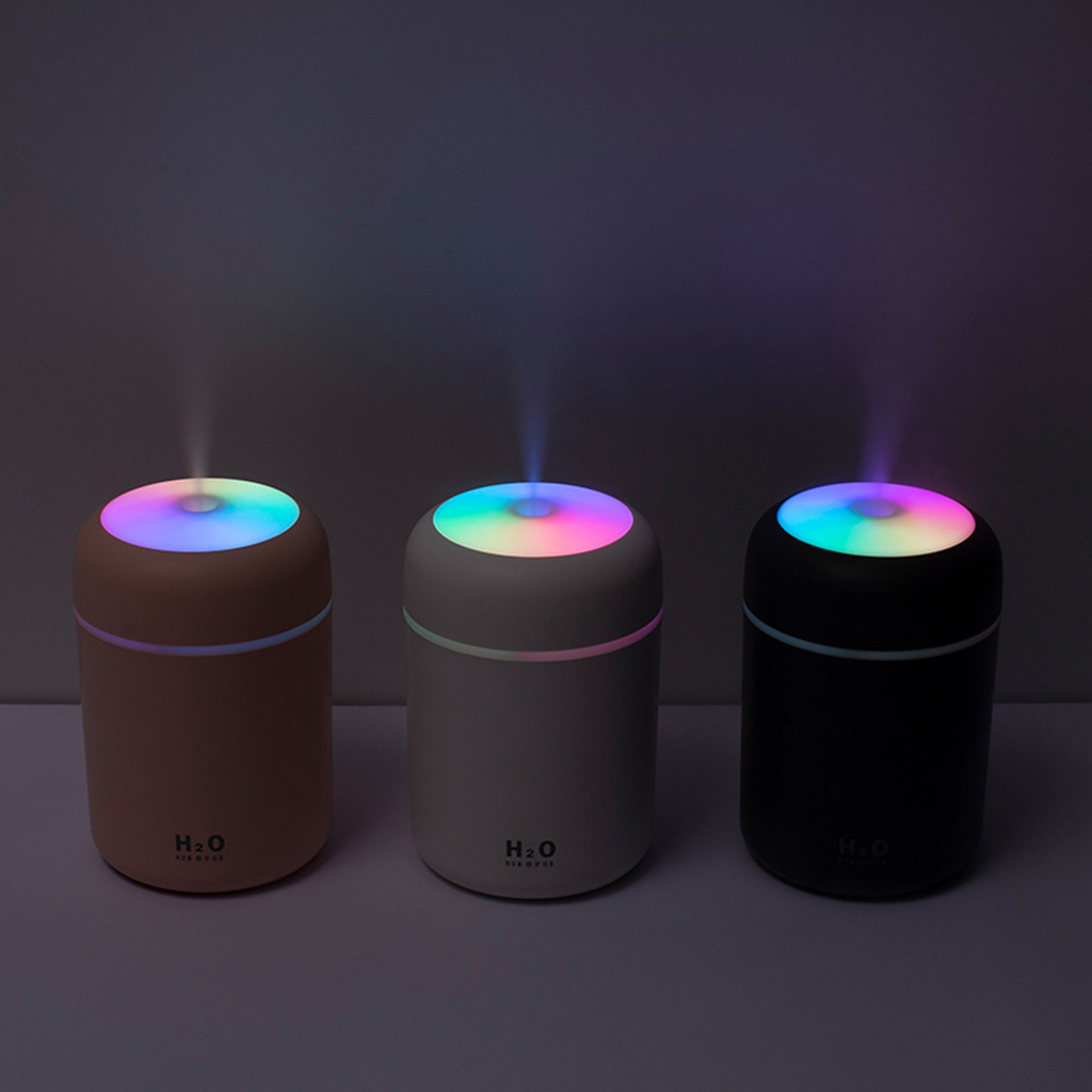 Teal Simba portable air humidifier and essential oil diffuser for car and home, showing a sleek white device with mist.