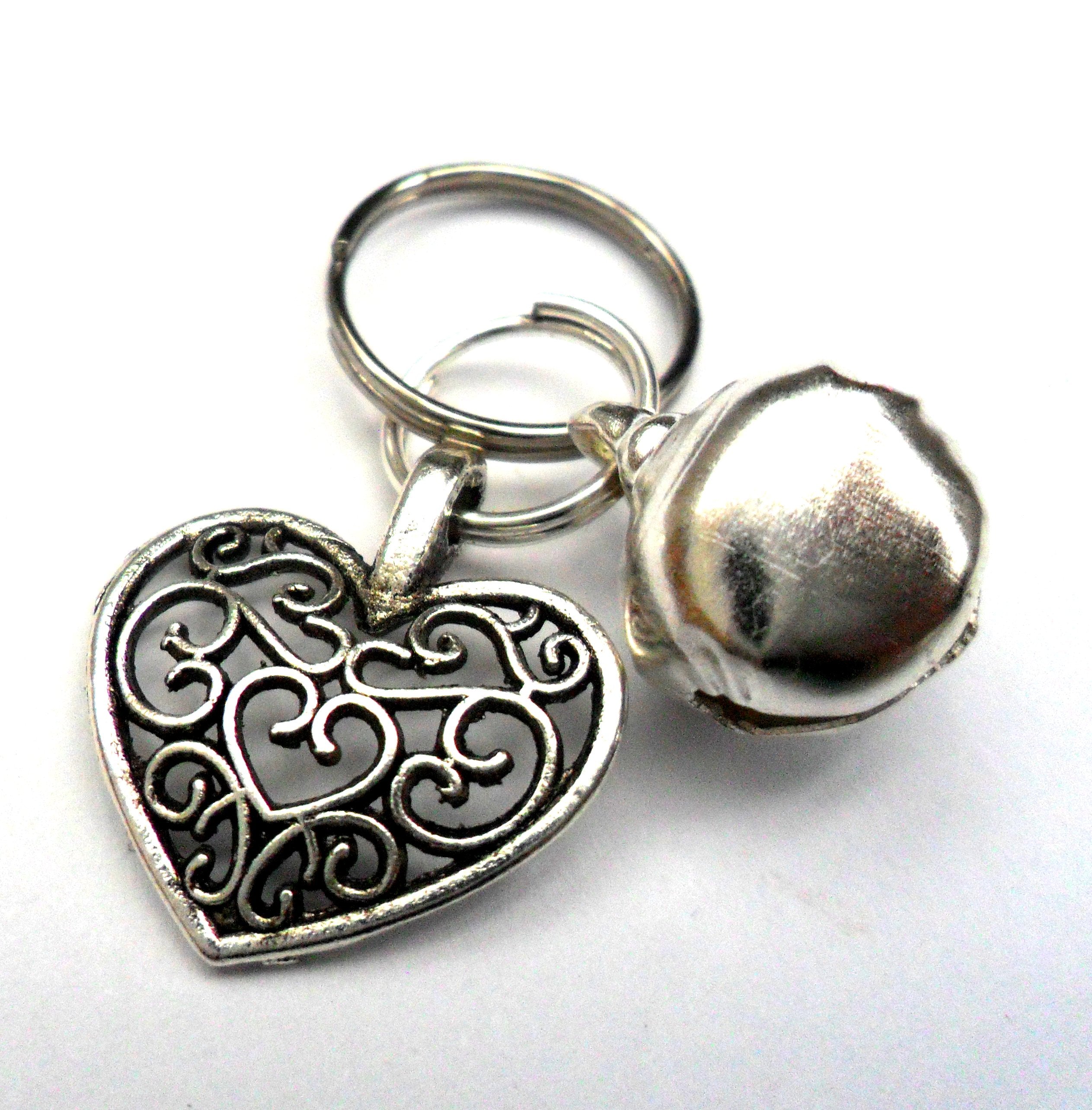 Salmon Oscar filigree heart pet charm attached to a collar, designed for leashes and petwear, showcasing intricate metalwork.