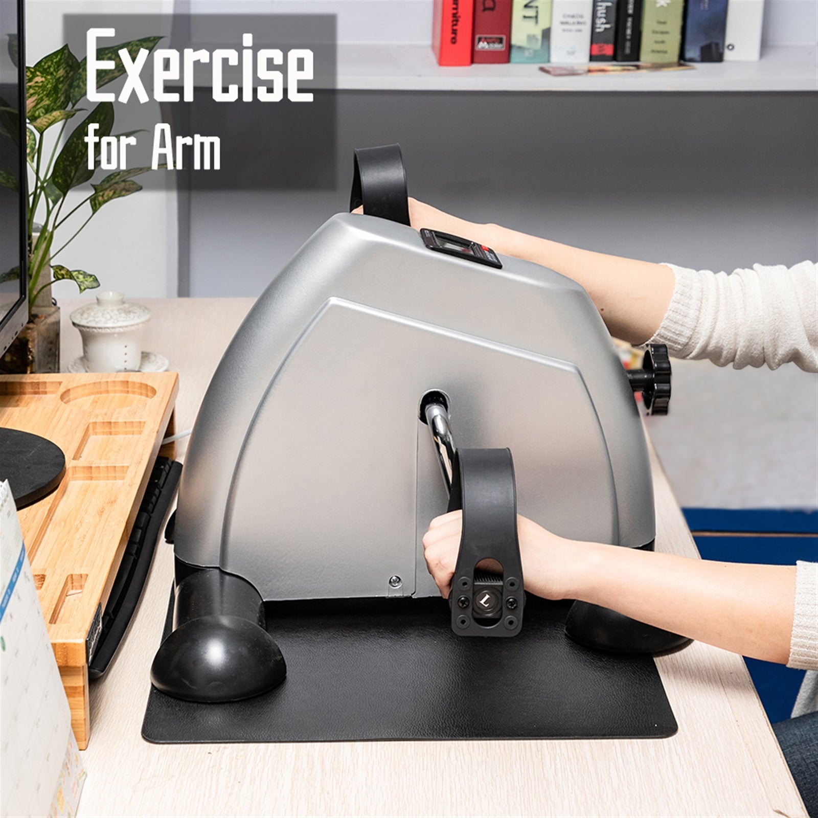 Lilac Milo mini exercise bike for hands and feet, compact sports and outdoors trainer showing foot pedals and adjustable resistance.
