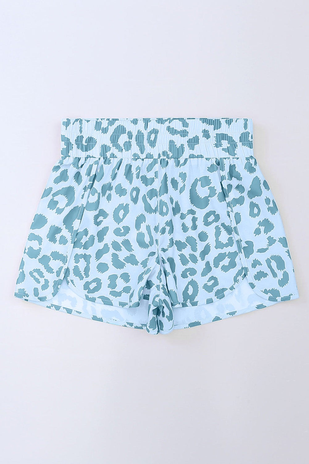 Byzantium Bay leopard and checker high waist athletic shorts displayed on a model with a black background.