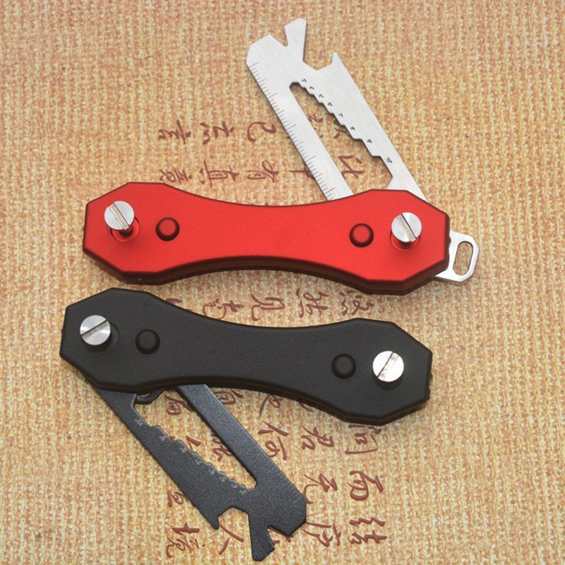 Fuchsia Molly camping utility key holder with integrated LED light, compact and practical for outdoor use.