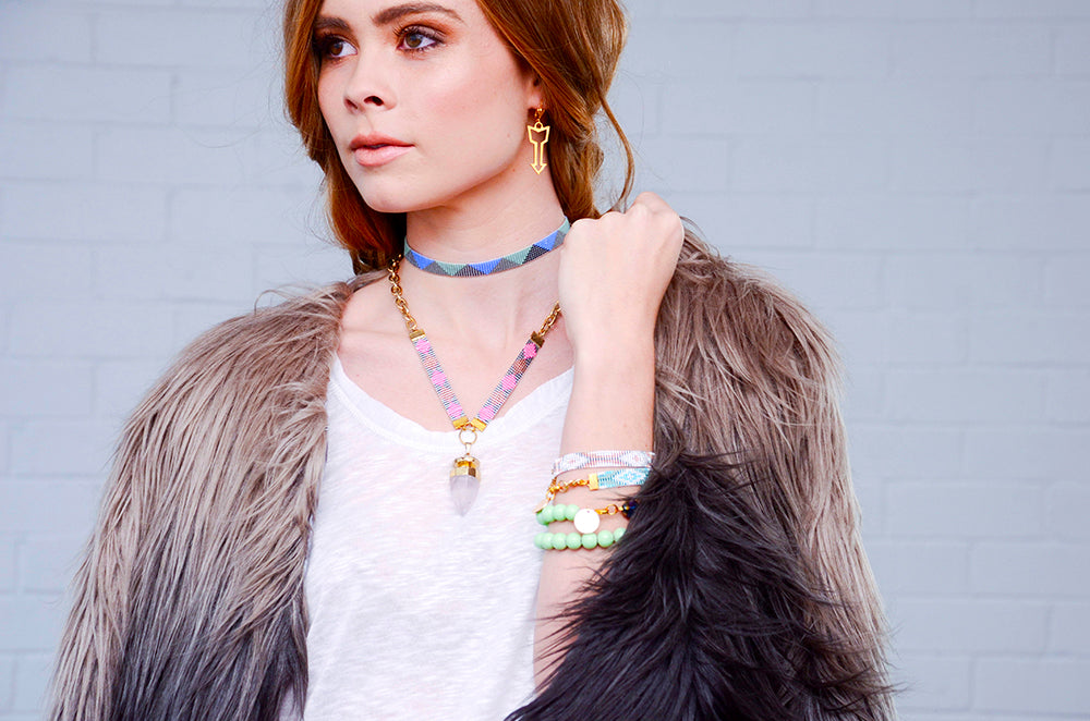 Yellow Athena Twilight bracelet with pink, orange, blue, and gold beads, featuring a delicate jewelry design.