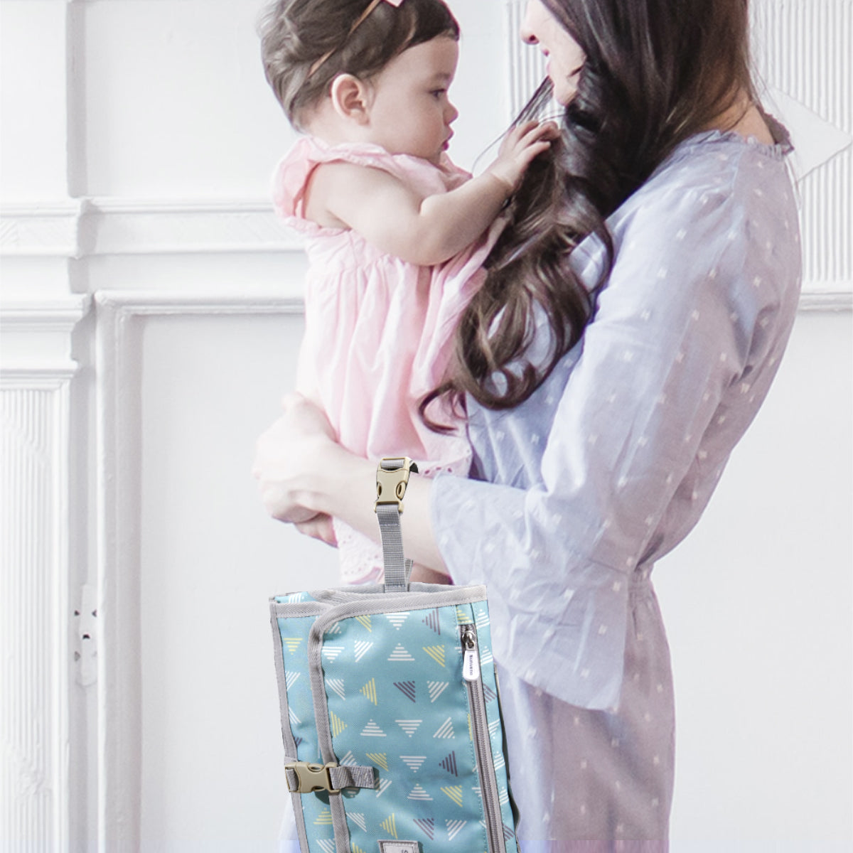 Maroon Chronos folding travel changing pad for kids and babies, compact and portable for on-the-go diaper changes.