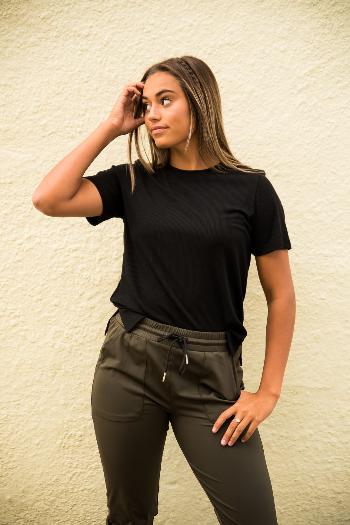 Black DT Alyssa Rib Knit Split Hem Tee by Lavender Danae, featuring ribbed fabric and stylish split hem detail.