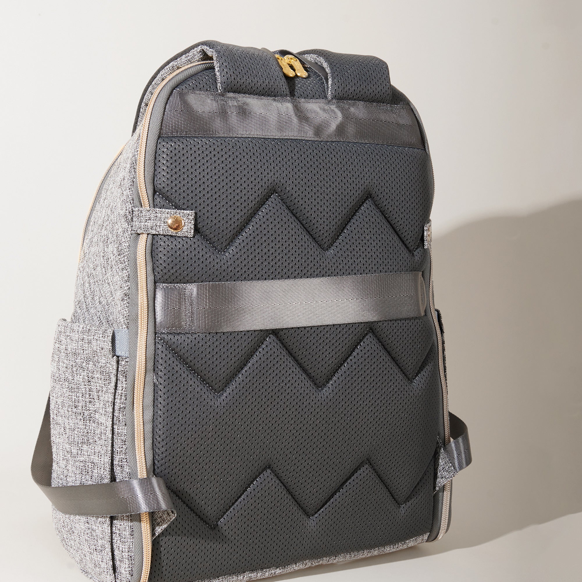 Maroon Chronos foldable diaper backpack with multiple compartments and adjustable straps, designed for parenthood and accessories.