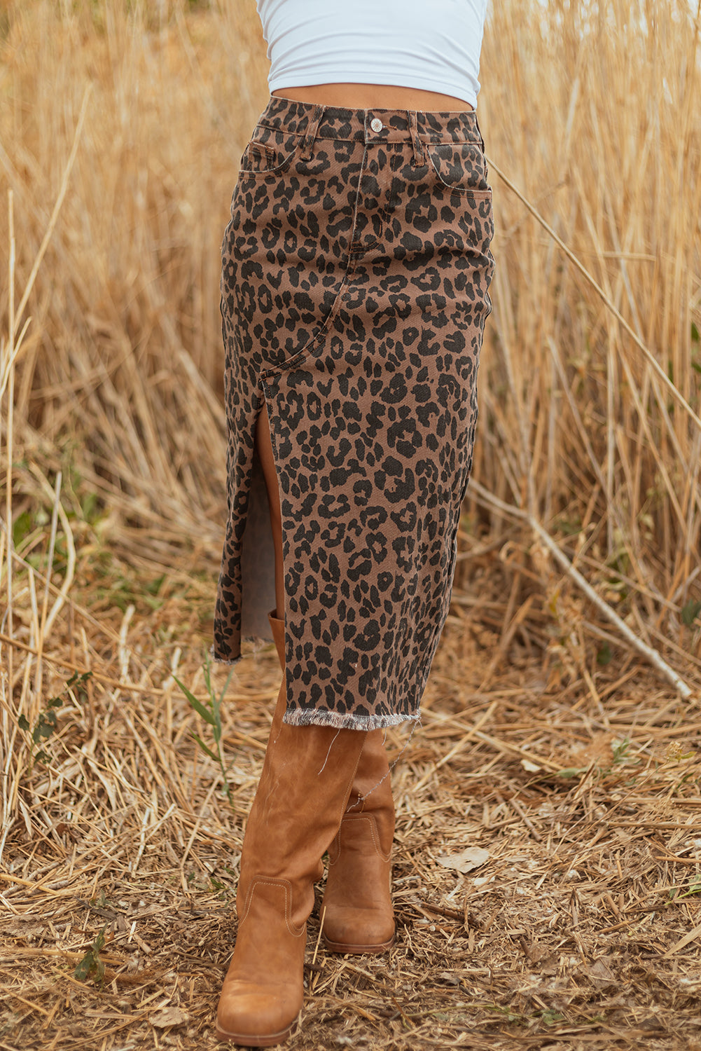 Leopard print denim midi skirt with frayed hem for women, Byzantium Bay fashion, shown with a casual style.