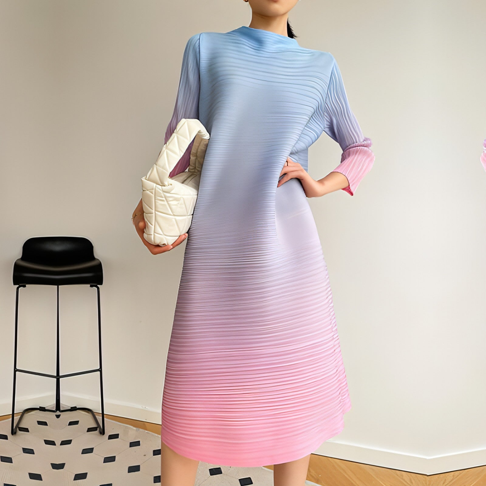 Plus size pleated dress by Carmine Juneberry featuring a flowy silhouette and elegant design for women.