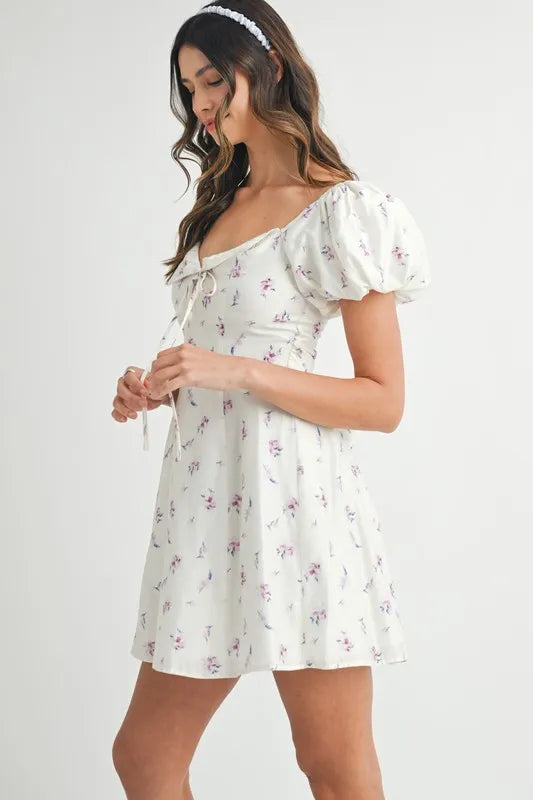 Pear Daisy floral print puff sleeve mini dress with a fitted waist and ruffled hem, perfect for casual or garden parties.