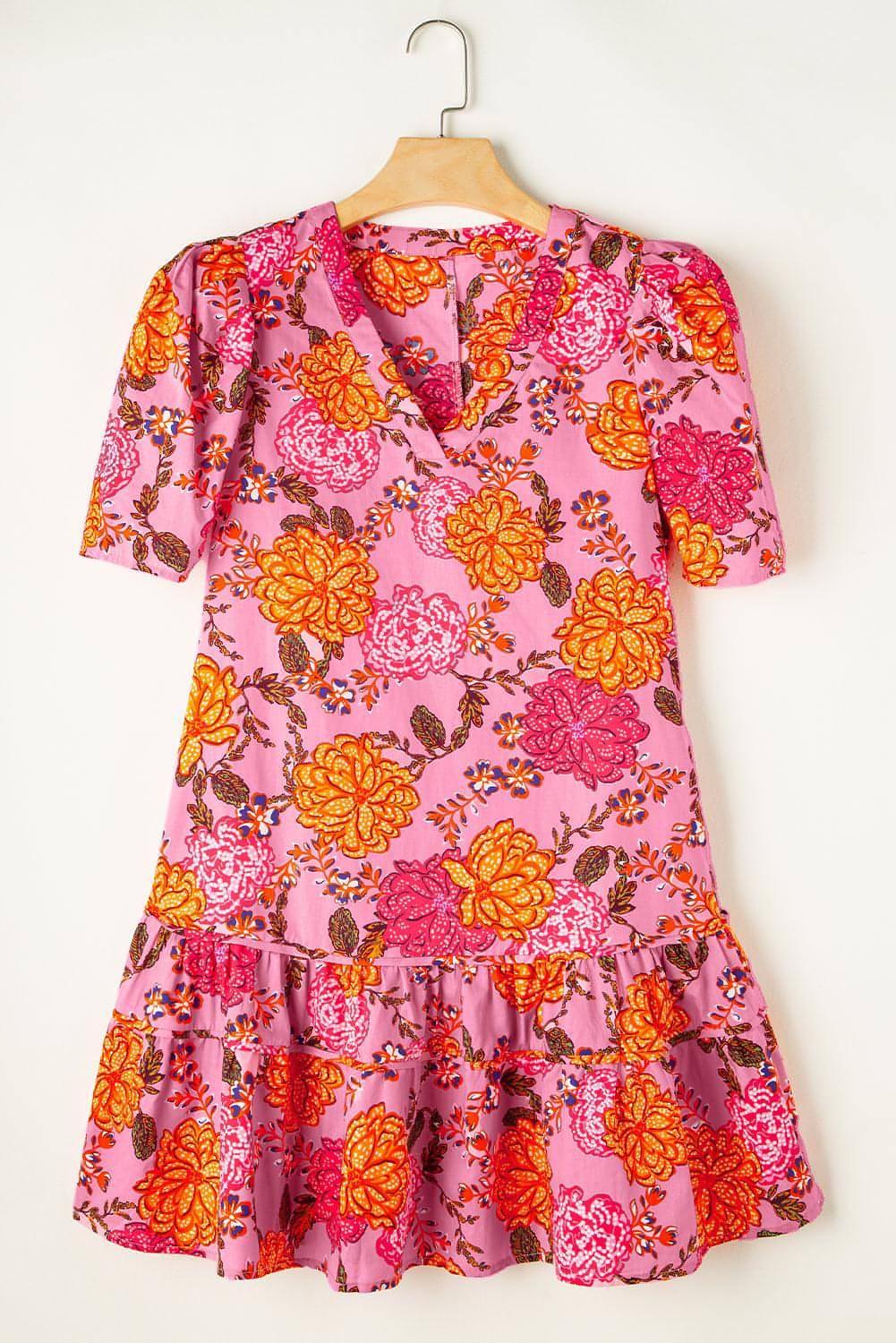 Pink floral bubble sleeve V-neck ruffled mini dress by Carmine Juneberry, featuring floral print and feminine ruffle details.