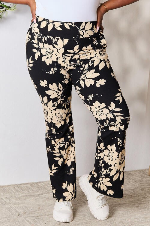 Heidi Flare Pants by Jade Icarus featuring high-waisted design and wide-leg silhouette, shown in a stylish fabric.