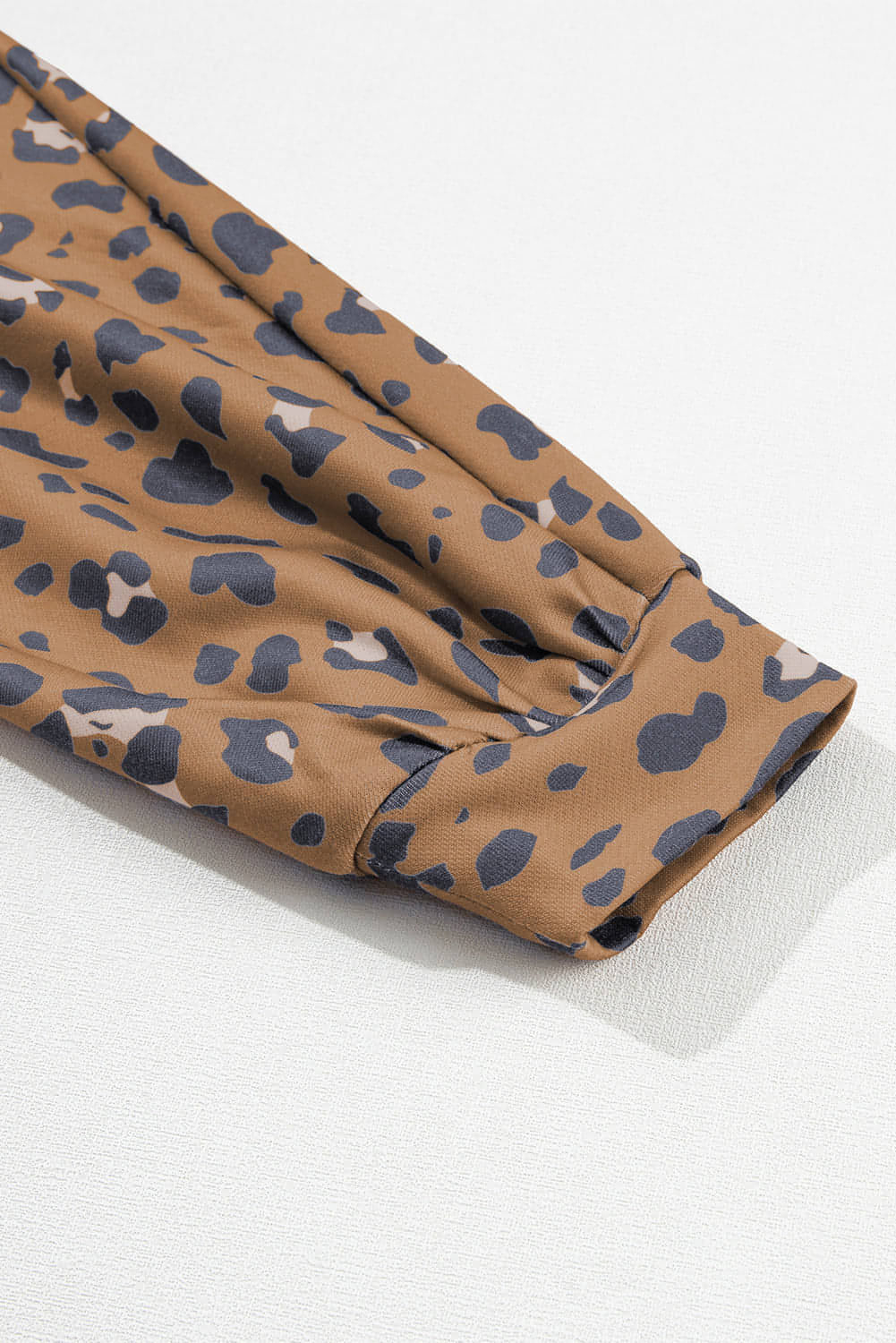 Brown printed raw edge leopard patchwork oversized blouse from Carmine Juneberry, featuring bold animal print and relaxed fit.