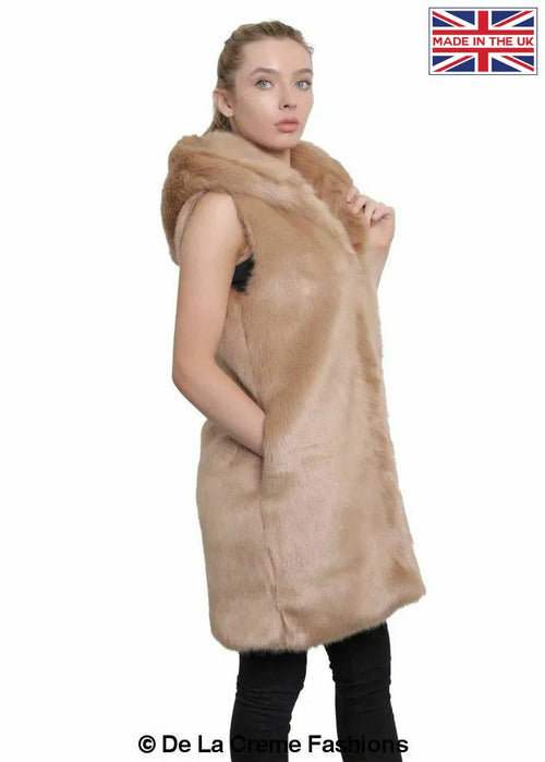 Rose Eleusis camel faux fur hooded gilet displayed on a hanger, featuring a cozy collar and lightweight jacket style.