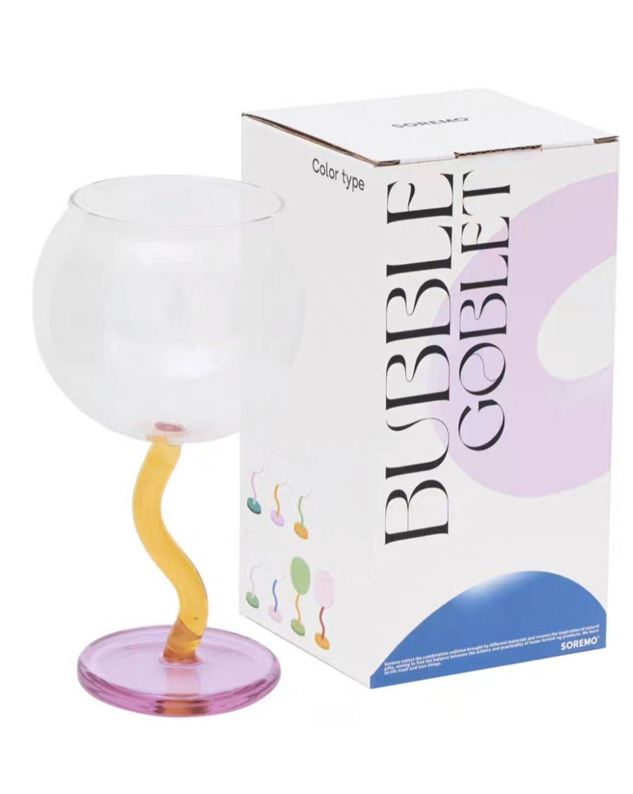 Handblown bubble wine glass with a wavy stem, vintage retro style, in burgundy, perfect for eclectic home decor.