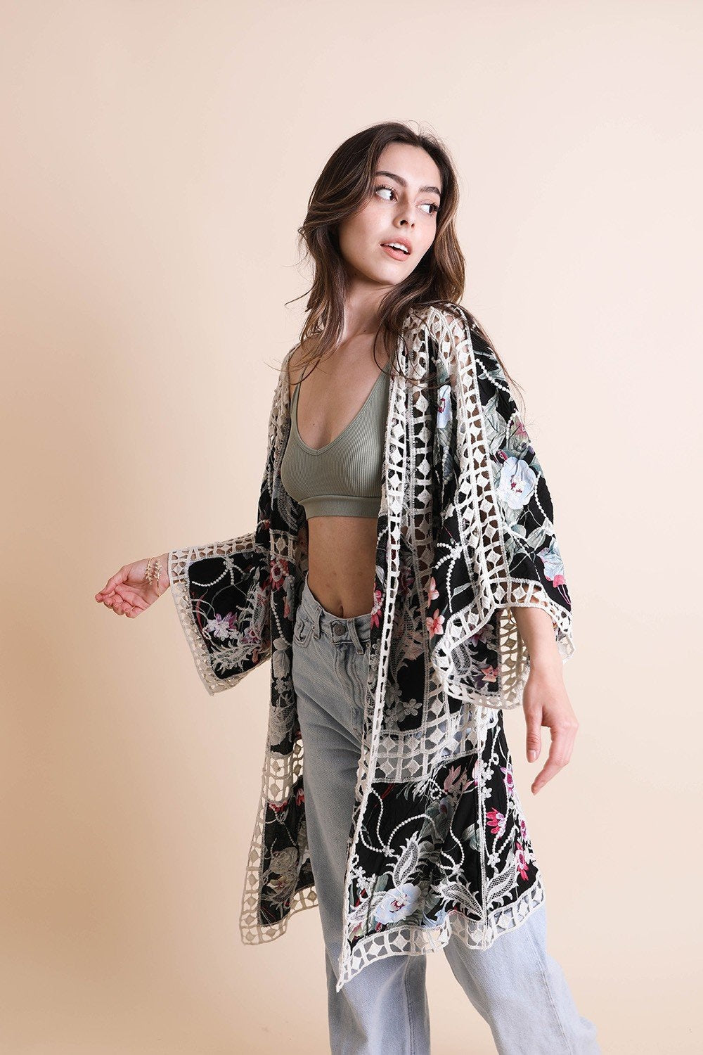 Black heirloom embroidered kimono by Periwinkle Aether, showcasing intricate embroidery and flowing fabric from the Leto collection.