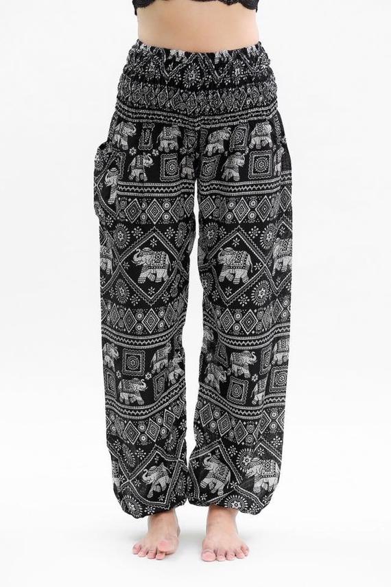 Black boho elephant print pants for women, Tan Smokey hippie yoga pants with relaxed fit and comfortable fabric.