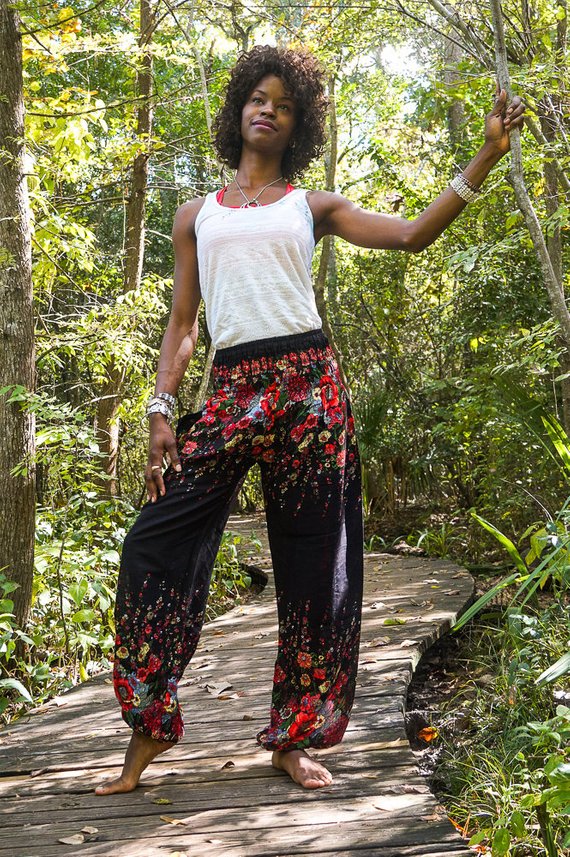 Black floral boho yoga pants for women by Tan Smokey, featuring a relaxed fit and vibrant floral pattern.