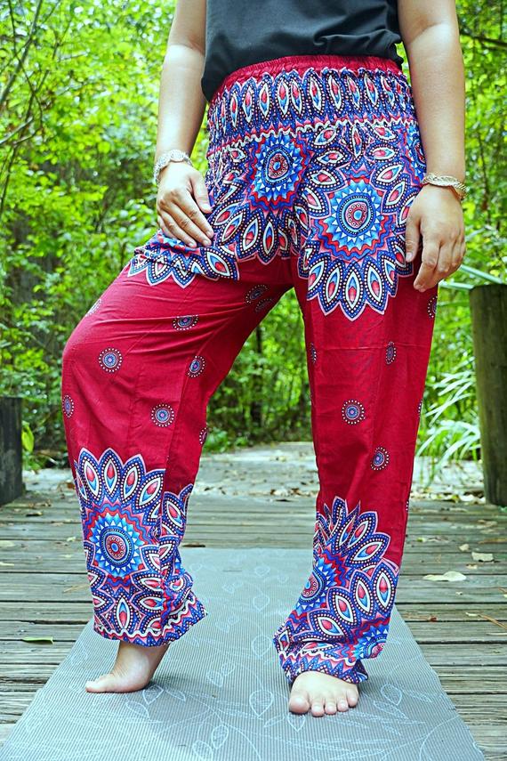Burgundy floral mandala boho pants for women, hippie style yoga pants by Tan Smokey, featuring vibrant floral patterns and relaxed fit.