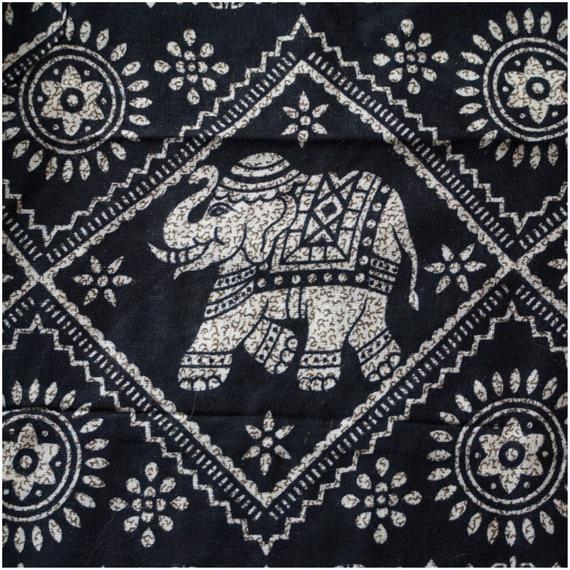 Black boho elephant print pants for women, comfortable hippie yoga pants by Tan Smokey, featuring relaxed fit and unique design.