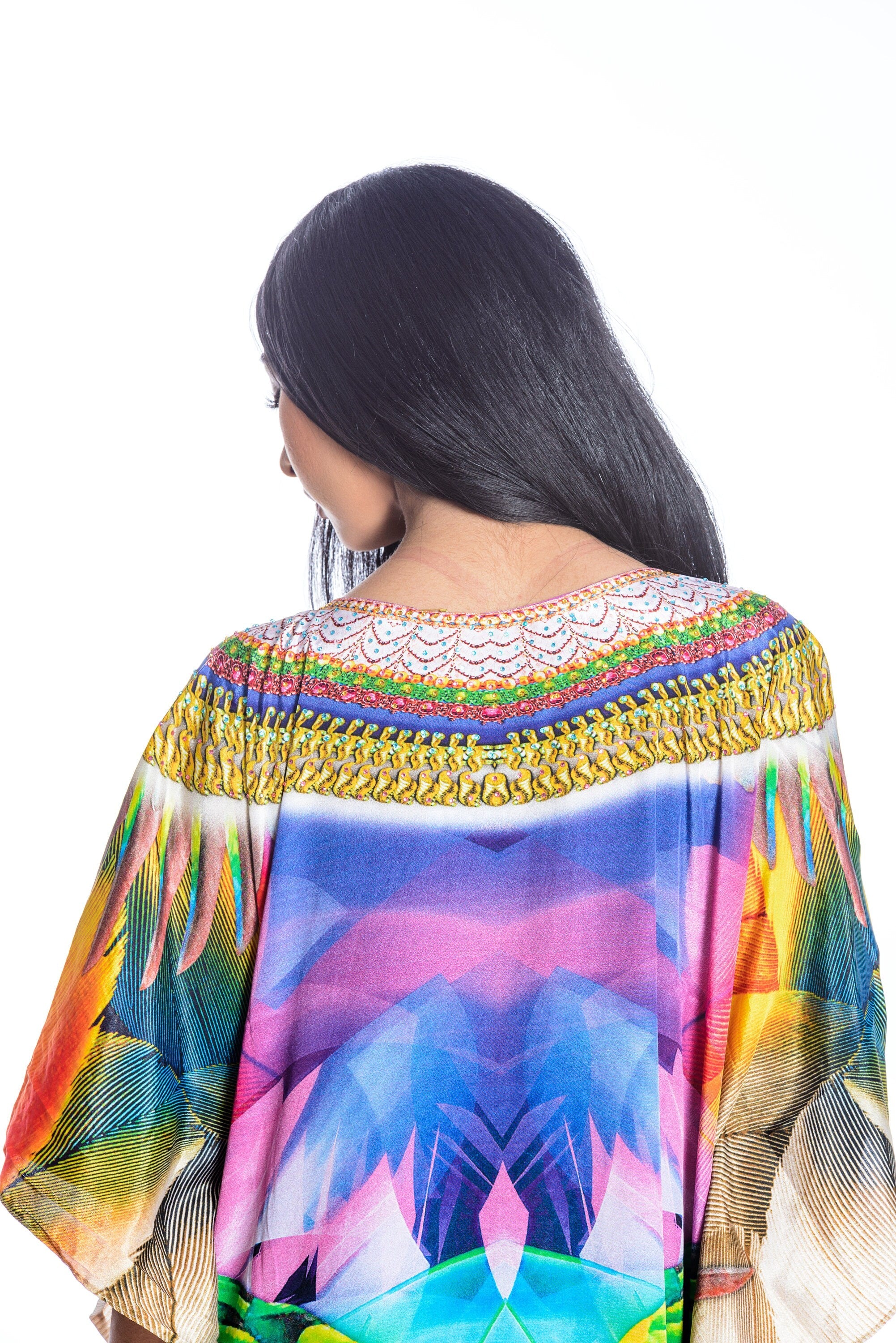 Plus size Mexican maxi kaftan dress by Erin Pontus featuring vibrant patterns and flowing fabric for women.