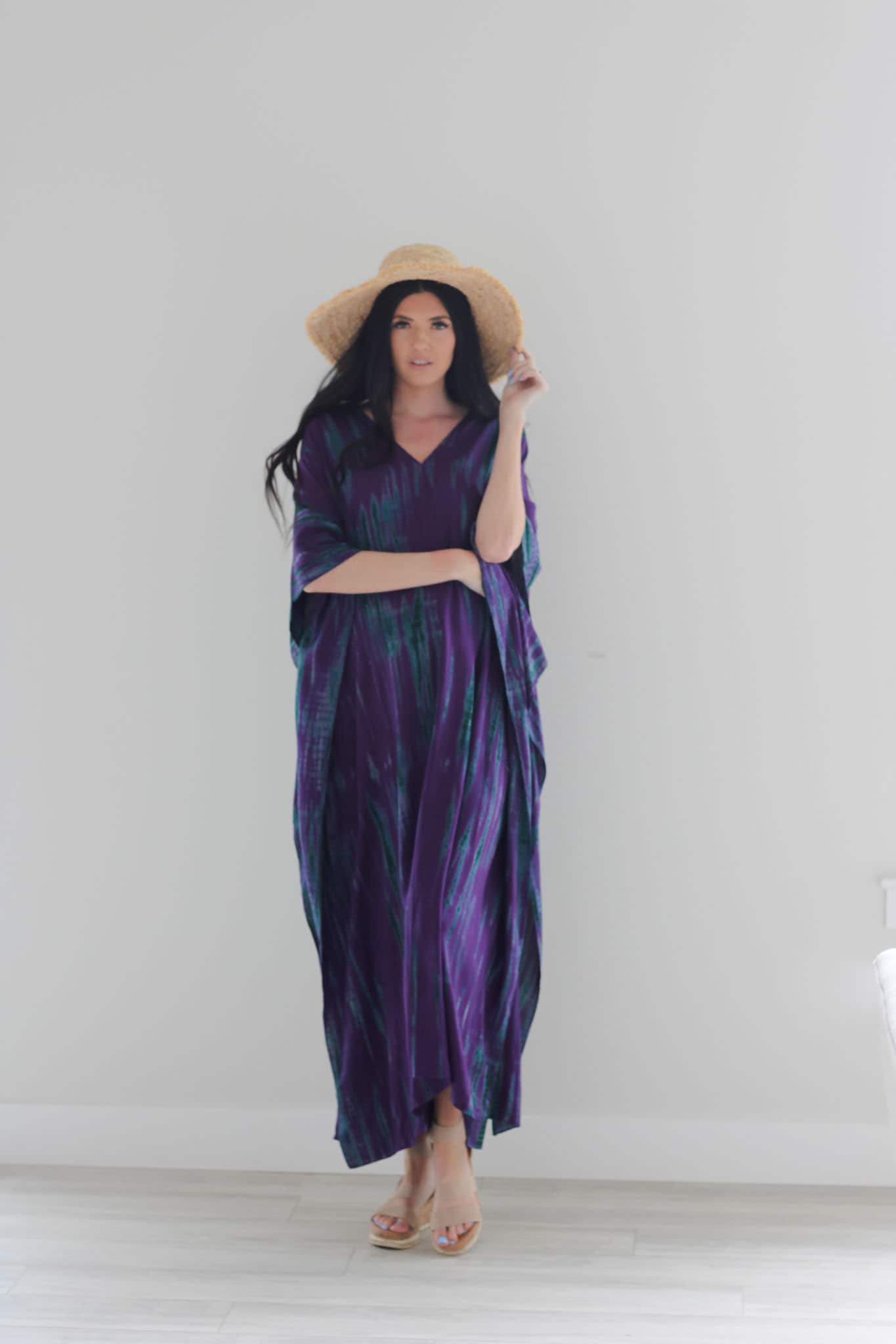 Purple tie-dyed maxi kaftan dress by Erin Pontus featuring a flowing, stylish abaya design with vibrant purple patterns.