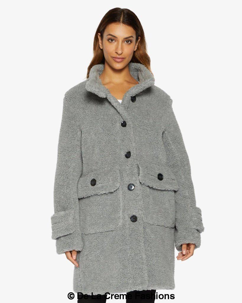 Rose Eleusis Julie high neck borg teddy coat displayed on a hanger, showcasing its cozy, plush fabric and stylish high collar.