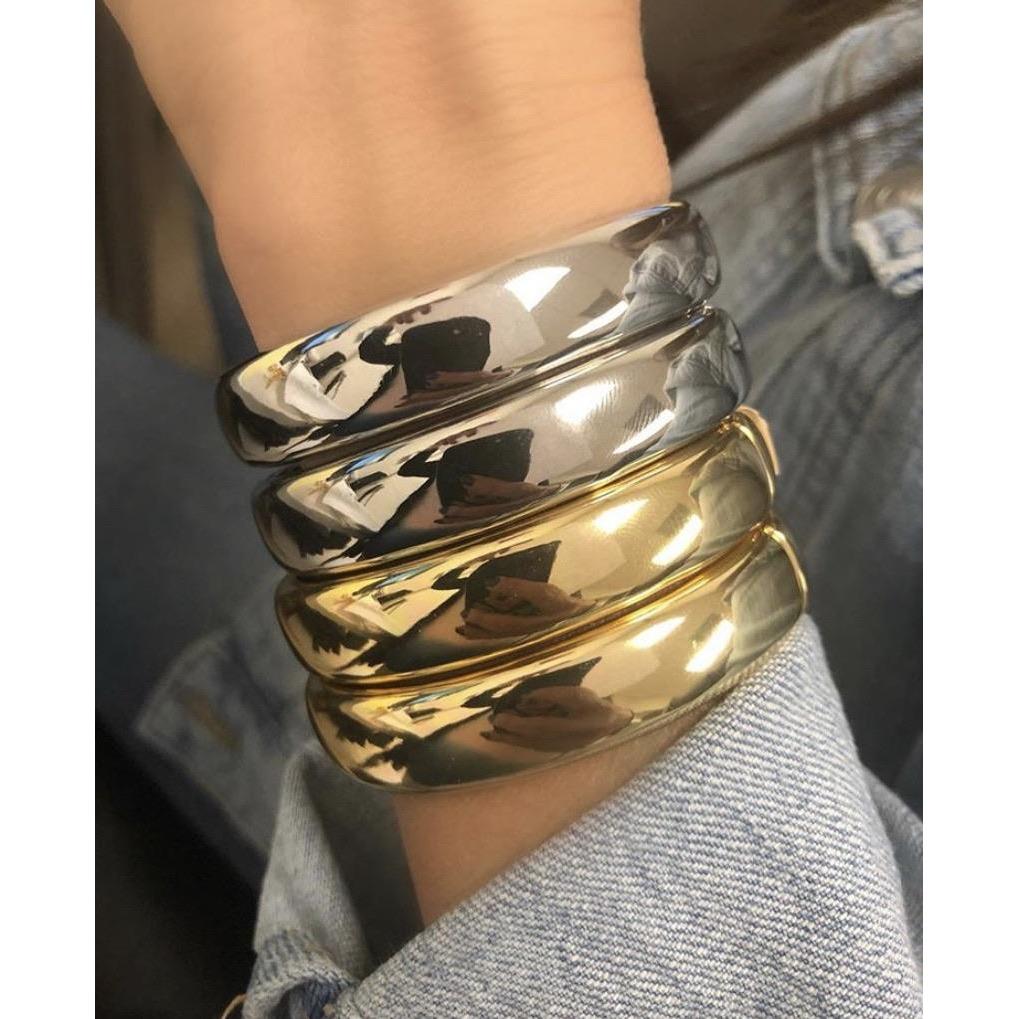 Bronze Lucy Liza bracelet with intricate design, showcasing a stylish jewelry bangle on a neutral background.