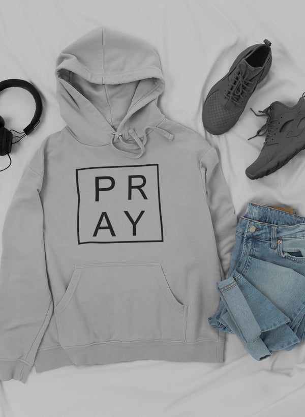 Pray hoodie by Jade Thalassa worn with trendy sneakers and jeans, casual outfit featuring a stylish pullover hoodie.