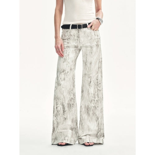 Black snake print flared denim trousers by Brown Coeus featuring a high waist and stylish fit.