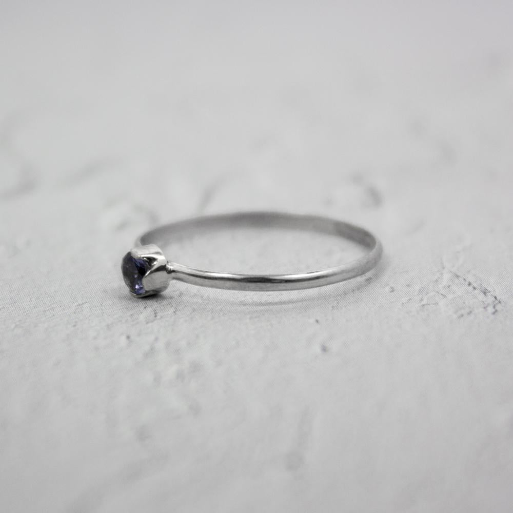 Sterling silver ring featuring a dainty Iolite solitaire gemstone, designed by Grey Clymene in jewelry and watches.