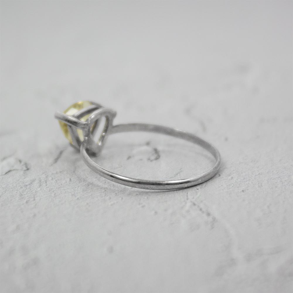 Sterling silver Lemon Topaz trillion solitaire ring with a vibrant yellow gemstone, designed by Grey Clymene.