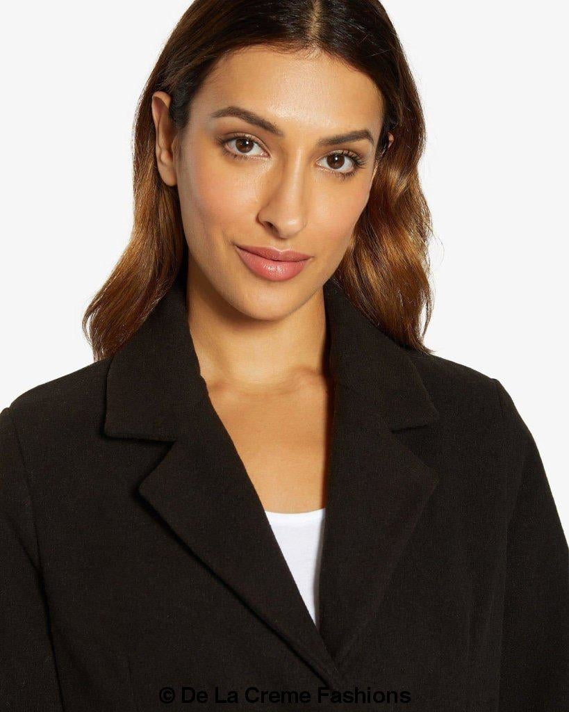 Rose Eleusis Sara Covert button-up coat, stylish jacket with a tailored fit, shown in a cozy, neutral fabric.