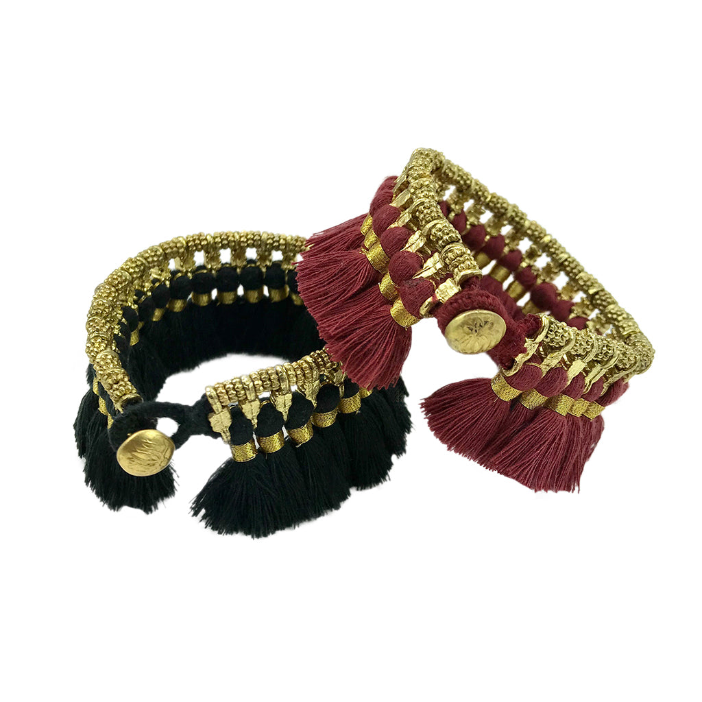 Ariel Kyra Tassel Bracelet featuring a slate-colored tassel and beaded design on a delicate bracelet strap.