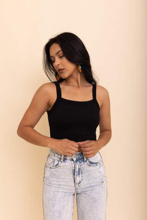 Black Seamless Brami Top by Periwinkle Aether, showcasing its sleek, fitted design and smooth fabric for comfortable wear.
