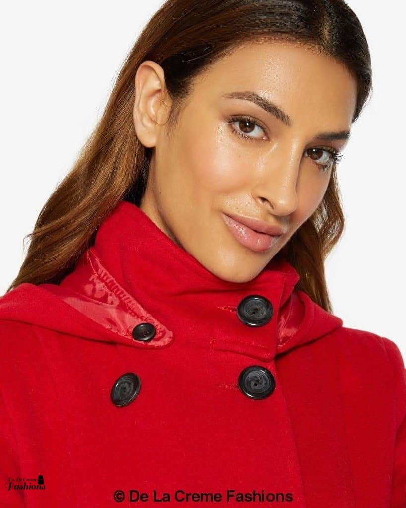 Double-breasted hooded coat by Rose Eleusis, shown in a stylish jacket with a hood and button details, perfect for cold weather.