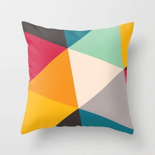 Scorpius tilting triangles pillow with geometric triangle pattern in soft fabric, designed for comfort and decorative use.