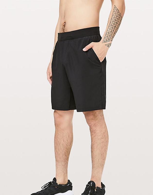 Black 9-inch mesh shorts by Sky Felix featuring a casual T-shirt style, displayed on a model.