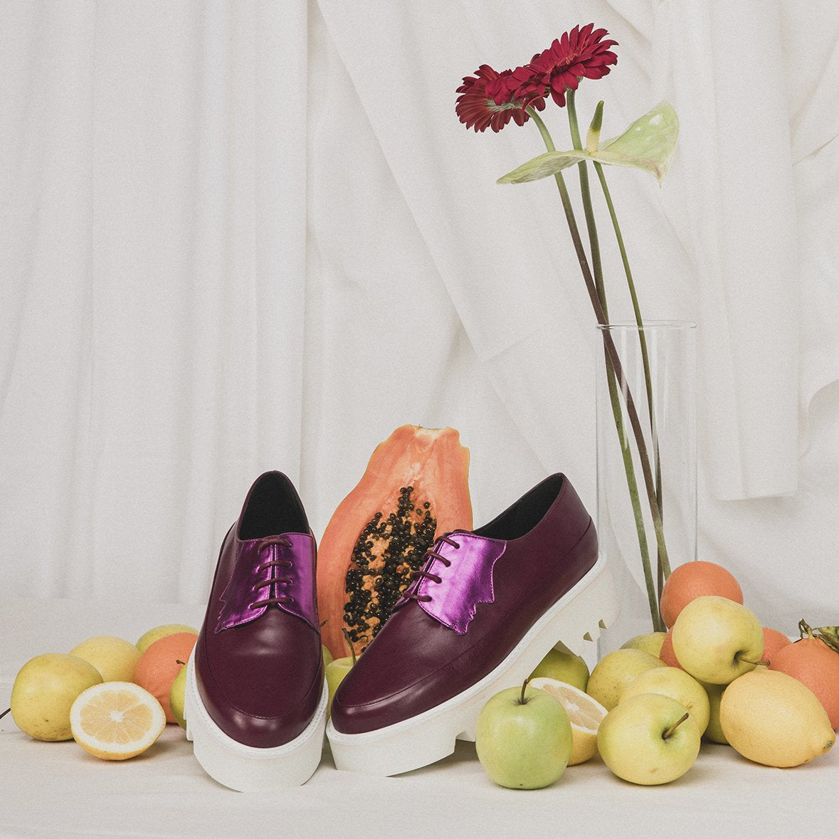 Red Electra Faced fuchsia leather platform creepers with chunky soles and lace-up design, stylish footwear for bold fashion statements.