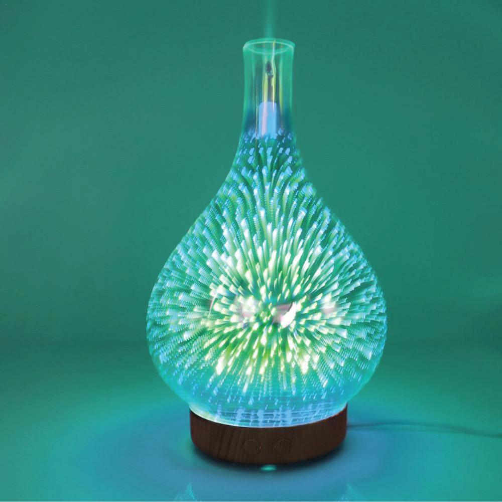 Ozdingo 3D Fireworks mirror ultrasonic aroma diffuser with glass body, LED lamp, and essential oil vapor for home aromatherapy.