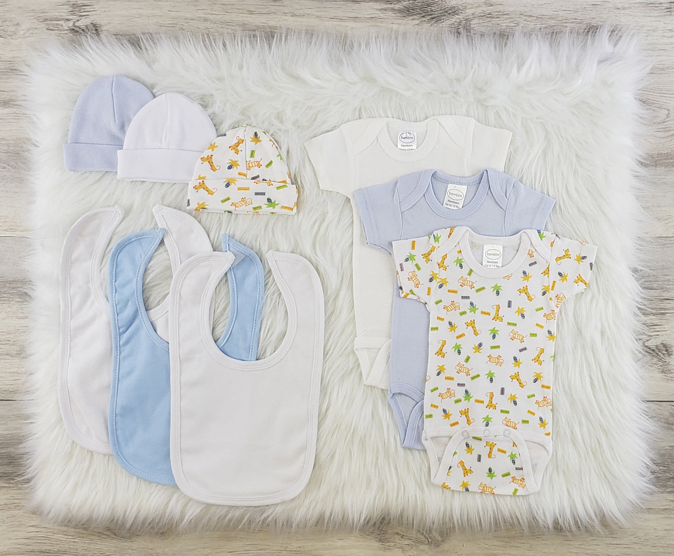 Emerald Clover Bambini 9-piece layette baby clothes set with soft, colorful onesies, hats, and matching accessories for infants.