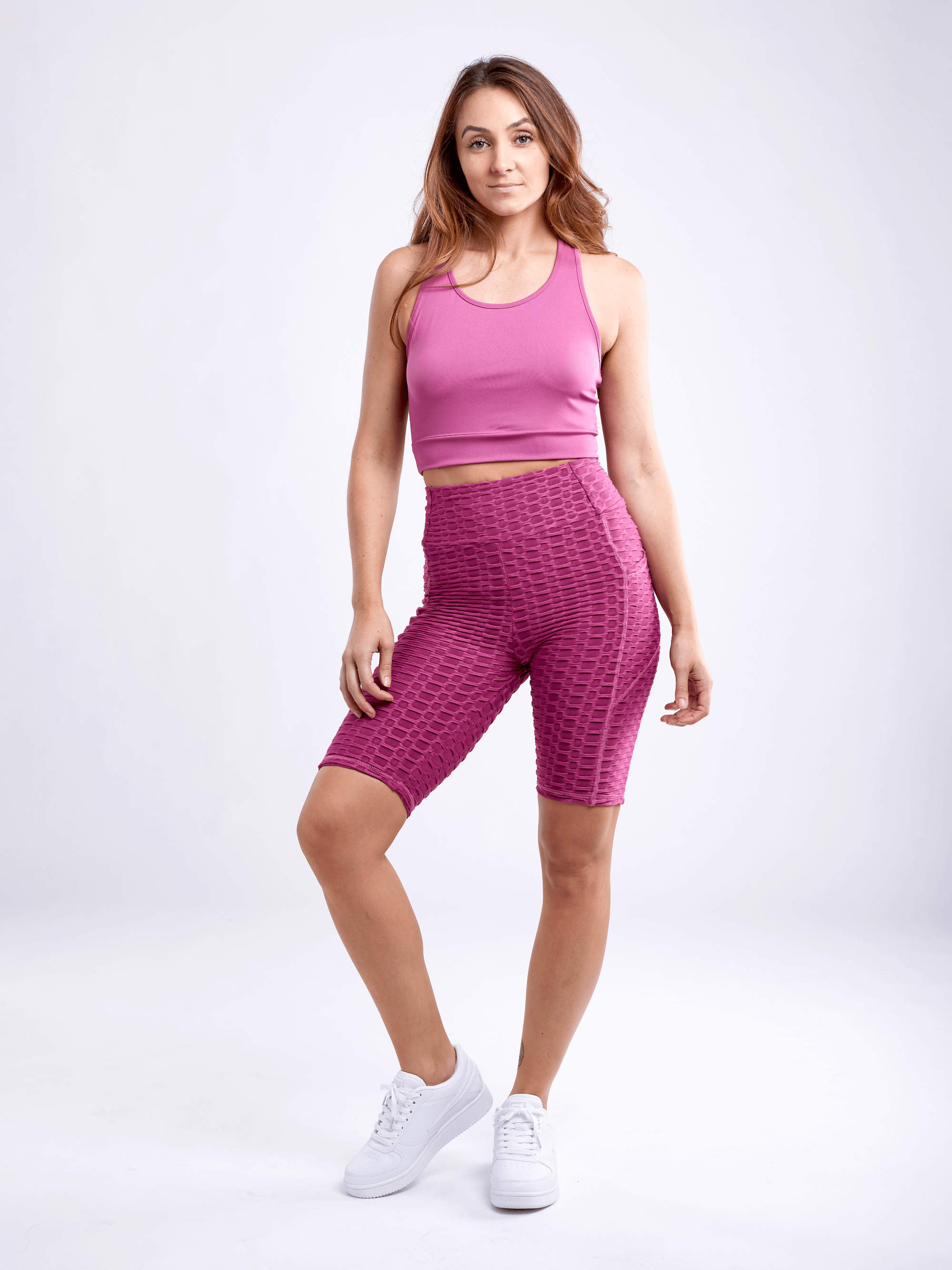 Black Lavender JupiterGear high-waisted scrunch yoga shorts with hip pockets, showing a close-up of the black activewear fabric and design.