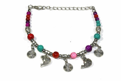 Silver Hestia Spirals and Fish Charm Bracelet featuring intricate metal charms on a sleek bracelet chain.