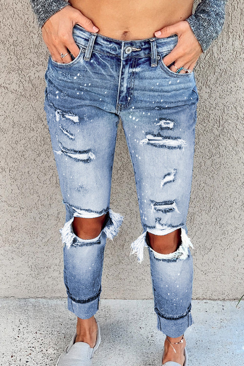 Light blue ripped straight leg jeans for women by Lavender Pallas, featuring distressed details and classic fit.