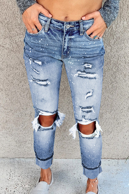 Light blue ripped straight leg jeans for women by Lavender Pallas, featuring distressed details and classic fit.