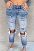 Light blue ripped straight leg jeans for women by Lavender Pallas, featuring distressed details and classic fit.