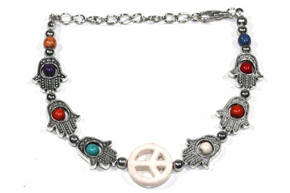 Silver Hestia Hamsa Hands and Peace bracelet featuring a silver charm with intricate design, perfect for spiritual protection and style.