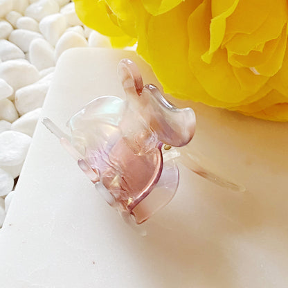Fuchsia Hercules butterfly-shaped hair claw jewelry accessory with metallic finish, decorative and functional hair clip.