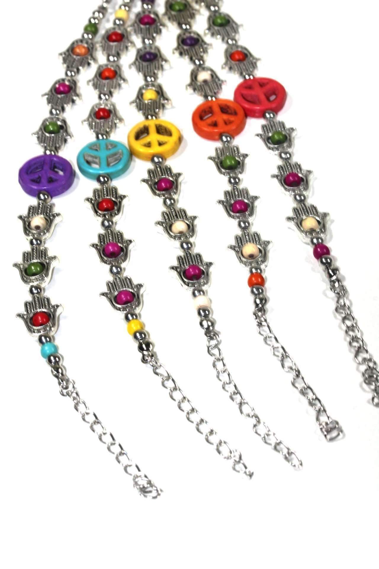 Silver Hestia Hamsa hands and peace bracelet with intricate designs, crafted in sterling silver, showcasing spiritual and protective symbols.